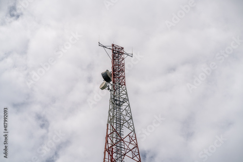 Telco Trellis for 4G 5G Apocalypse Internet Communication, FM Radio and Television Broadcasting On Air with Blue Sky in Background.