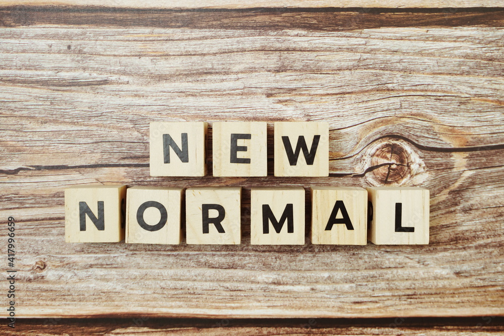New Normal alphabet letter on wooden background