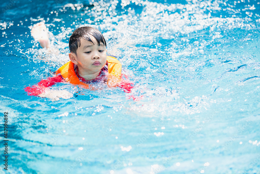kid boy swimming pool exercise in holiday activities. swim practice sports. kid boy swimming pool exercise in holiday activities. swim practice sports.