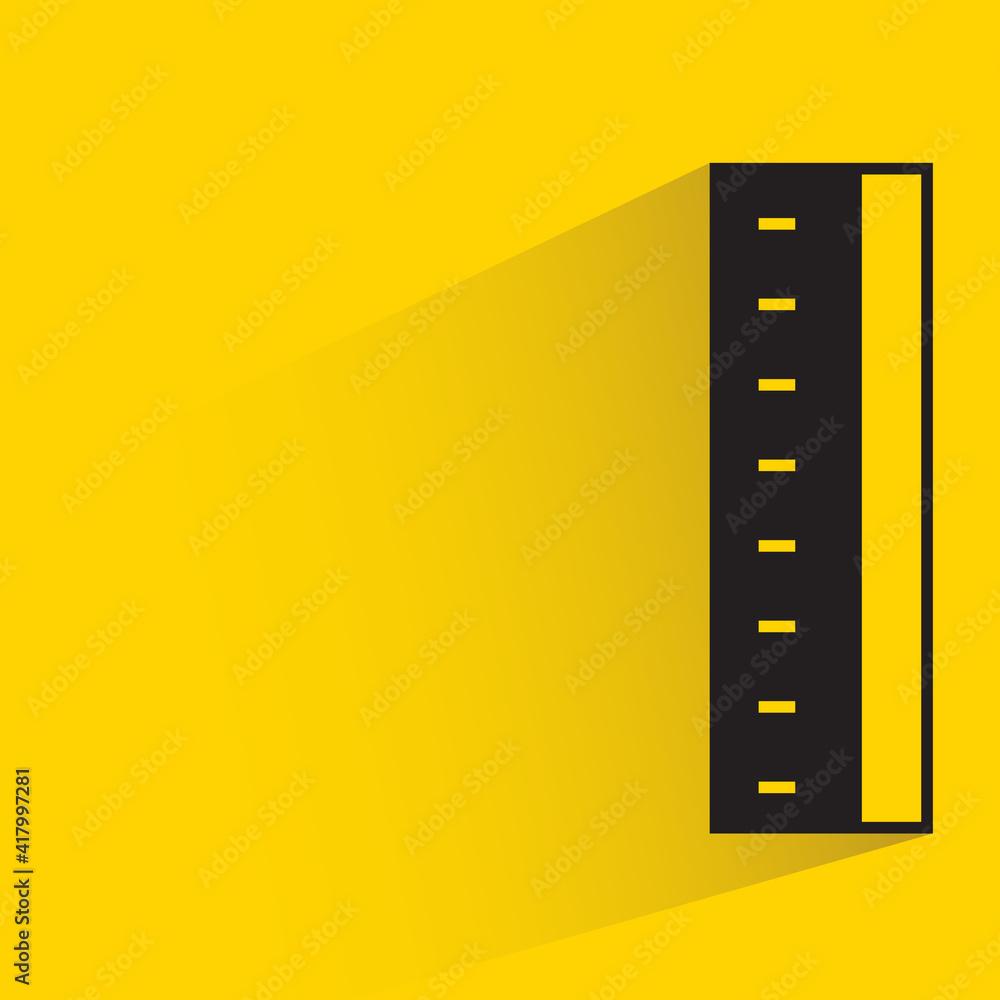 Obraz premium ruler with shadow on yellow background