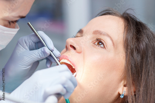 Examination oral cavity or treatment teeth, visiting dental office