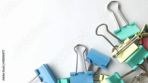 blue paperclip with white background