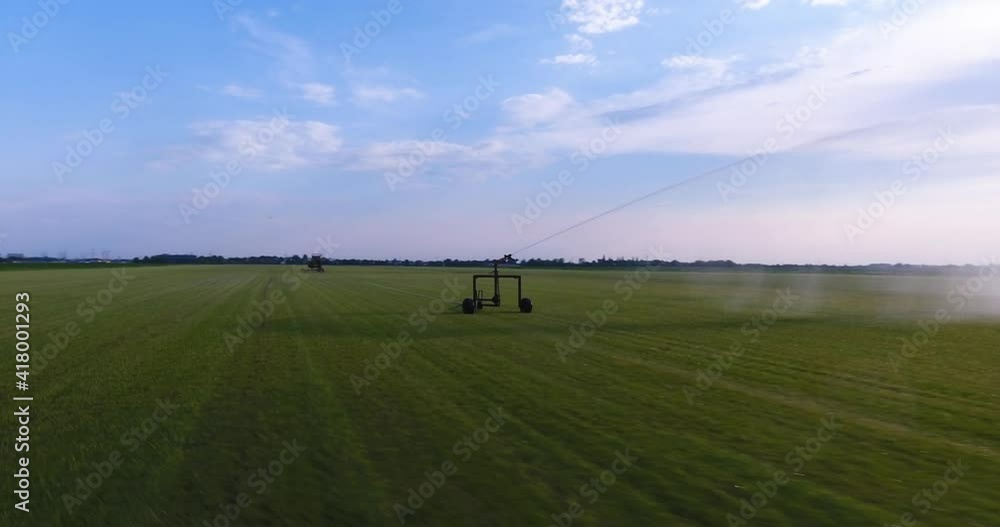 Circling Around Irrigation System Watering A Meadow Circling Around Irrigation System Watering A Meadow