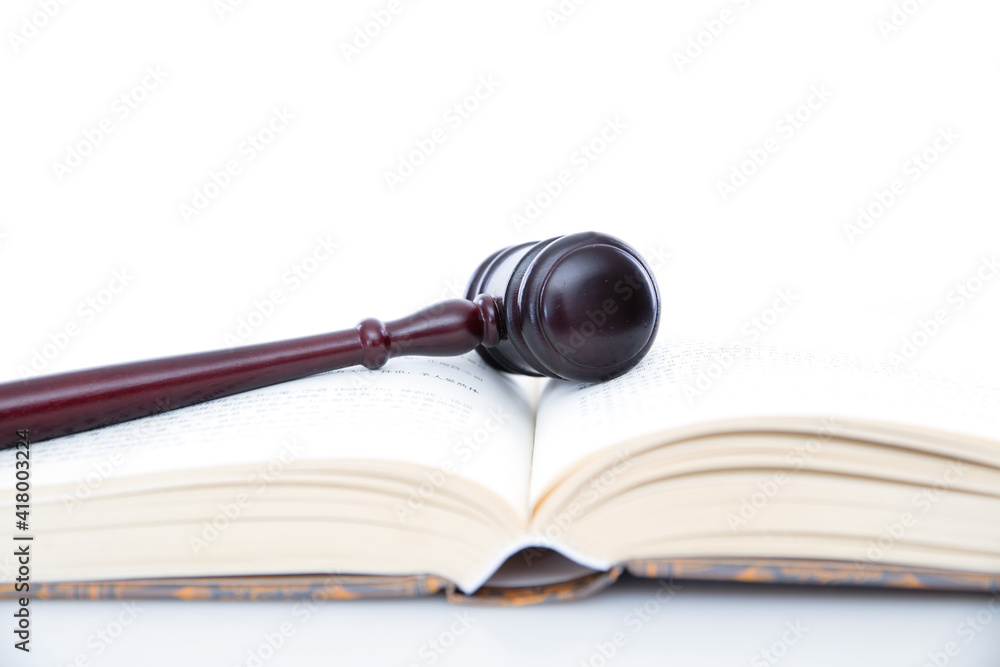 Open books and court mallets on a white background Open books and court mallets on a white background