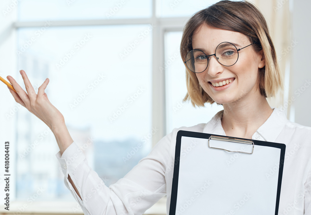 portrait of business woman with white sheet of paper in finance folder portrait of business woman with white sheet of paper in finance folder