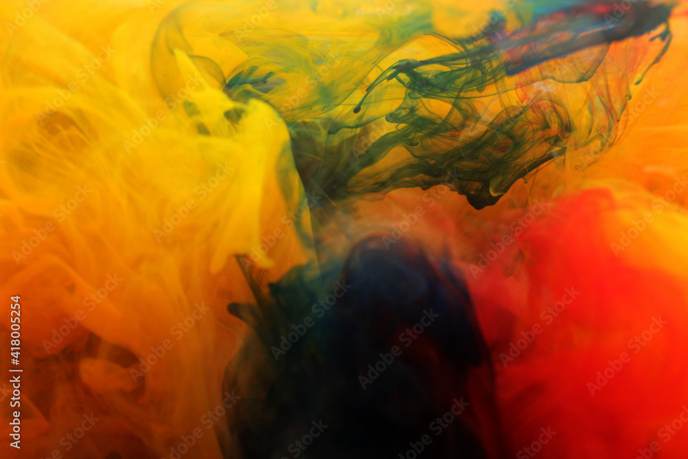 water red yellow green blue orange  in water with a yellow background. like abstract-style smoke paintings