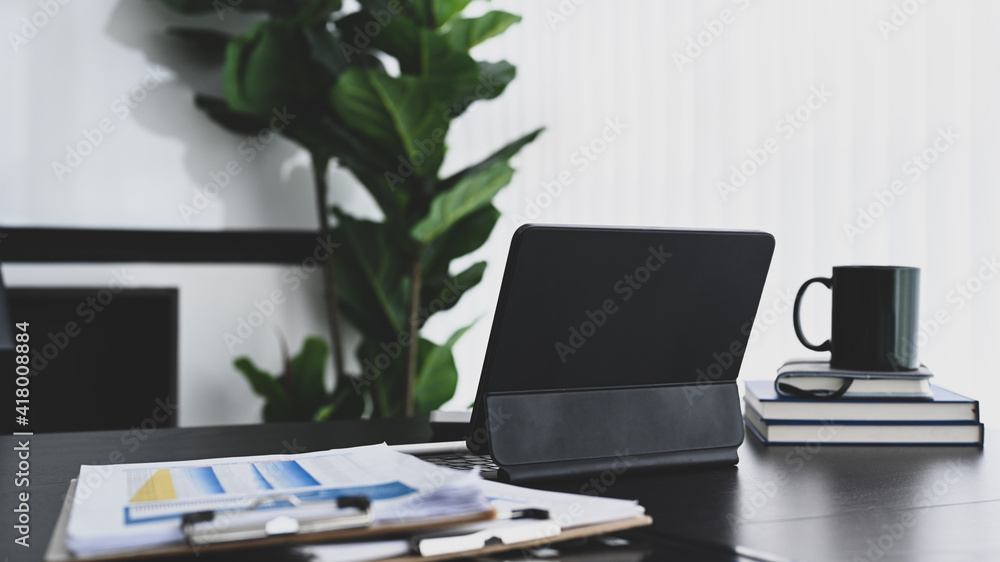Fototapeta premium Tablet computer, coffee cup and documents on office desk.