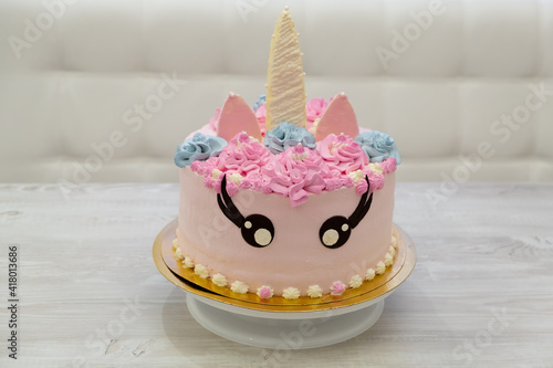 birthday cake in the form of a pink unicorn cat. Sweet cute cake