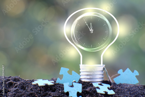 Energy saving light bulb and business or business growth concept