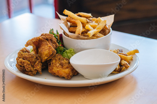 fried chicken wings with fries