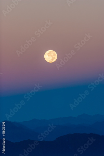 Full Moon Rising over the Himalayas at Dawn  as seen from Poon Hill  Nepal