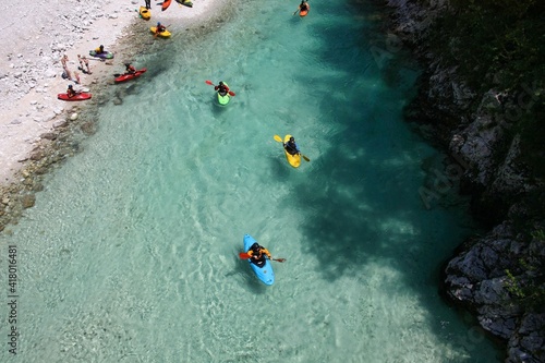 Fantastic rafting and kayaking place. Active kayaker with colorful life jacket, paddling and exercises on the emerald colored Soca river, Bovec, Triglav National Park, Slovenia, Europe © designbetrieb.de