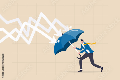 Fototapeta Protection or defensive stock in economy crisis or market crash, business resilient to survive difficulty or insurance concept, businessman holding umbrella to cover and protect from downturn arrow