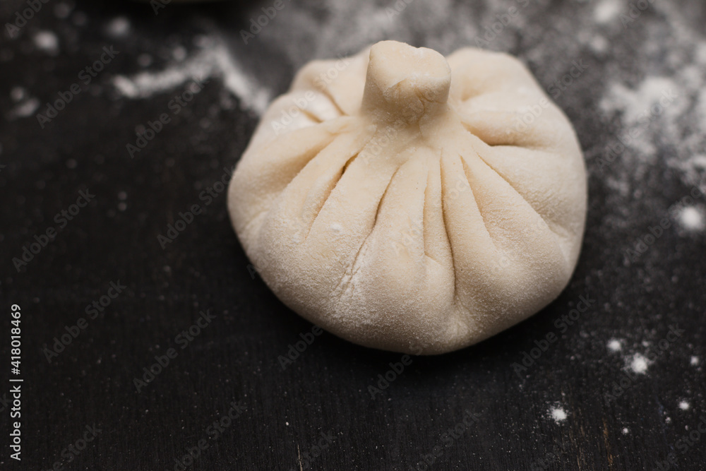 raw Georgian khinkali sprinkled raw Georgian khinkali sprinkled