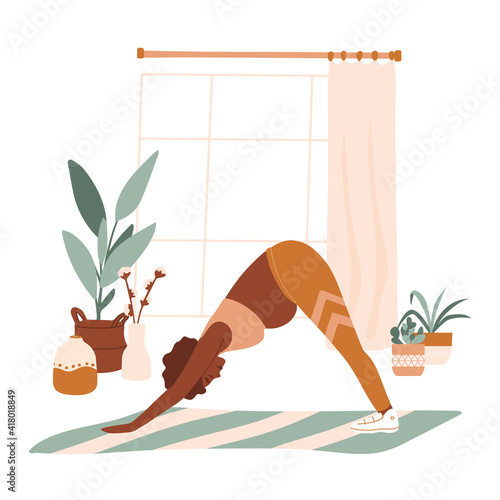 African pregnant woman in sportswear doing stretching physical exercises. Dark skin young mother with belly practicing prenatal yoga exercise class at home. Relaxation, stretching, working out.