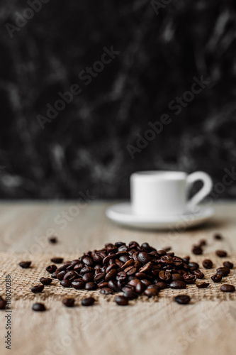 Coffee beans and a cup on the table