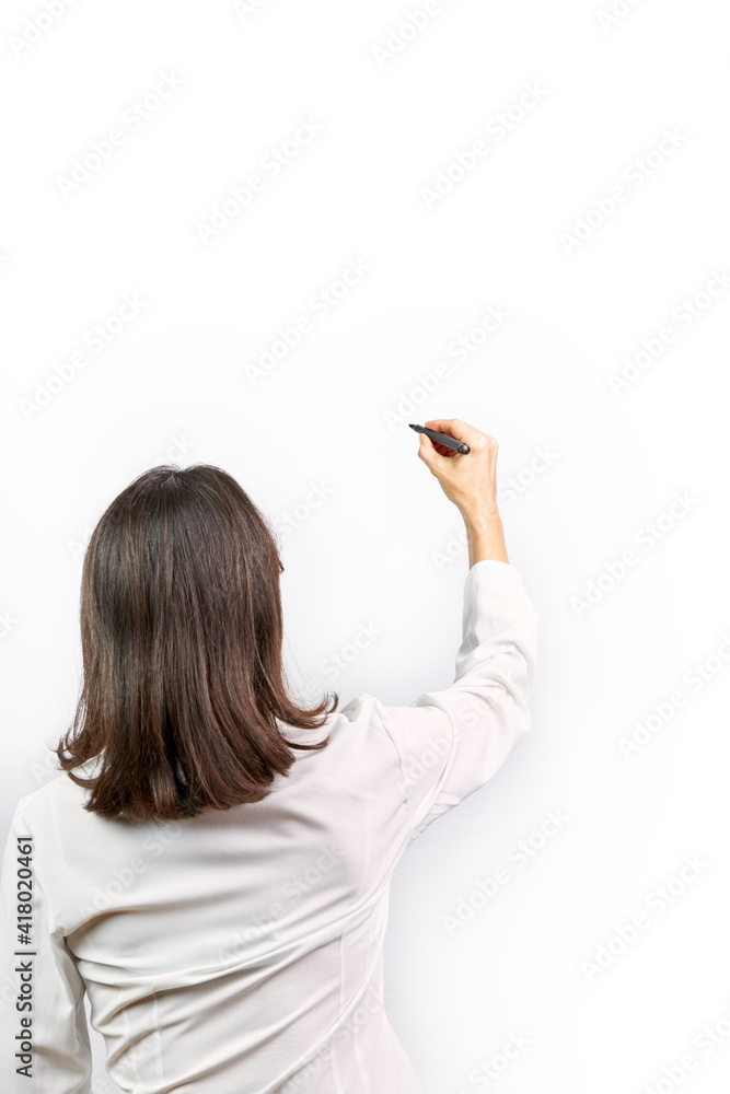 Executive woman writing with a black marker pen on a white background Executive woman writing with a black marker pen on a white background