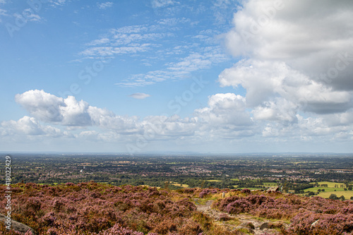 Footpaths on the top of a high vantage point with panoramic views of the British countryside beyond