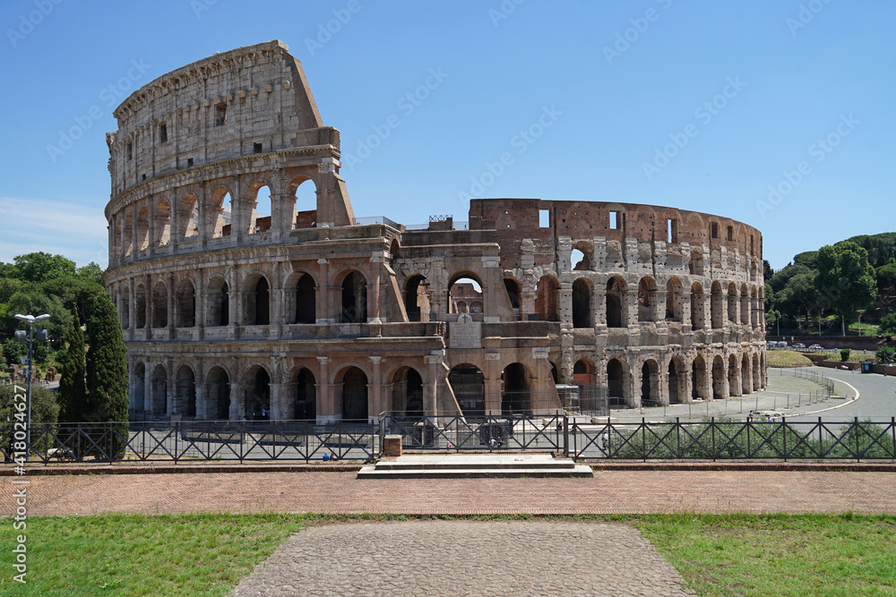 Ancient Roman amphitheater and gladiator arena Colosseum aerial view, heart of Roman Empire, famous tourist landmark, guided tour concept, Rome, Italy