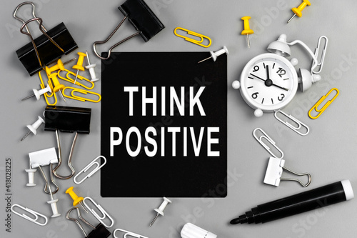 Think positive - concept of text on sticky note. Work and study concept