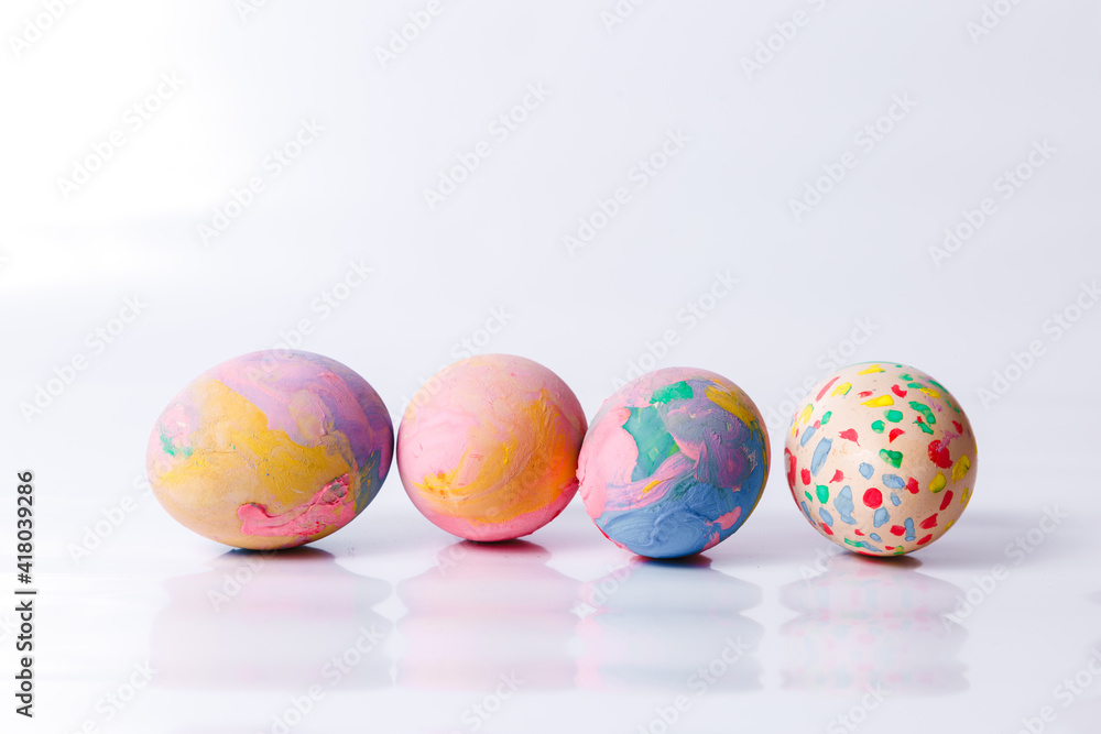Fototapeta premium Happy easter, Easter painted eggs on white background for your decoration in holiday. Copy space.