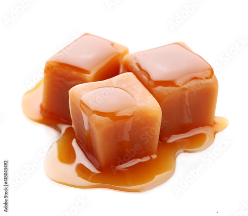 Sweet caramel candy with caramel topping