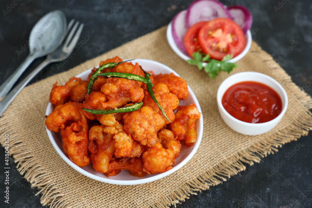Gobi Manchurian dry, Gobi 65 with tomato sauce popular Indian street food snack Delhi Mumbai India made cauliflower florets Veg Manchurian chilly gobi Indo Chinese side dish chapati roti Gobi Manchurian dry, Gobi 65 with tomato sauce popular Indian street food snack Delhi Mumbai India made cauliflower florets Veg Manchurian chilly gobi Indo Chinese side dish chapati roti