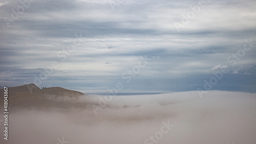 a cloud on the ground, shore of lake baikal