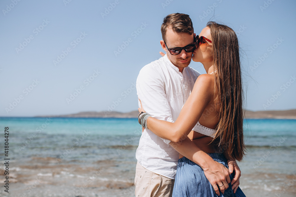 Happy Couple hugging at the sea beach, adult, summer holidays