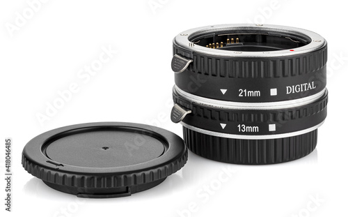 Two macro rings for DSLR camera with opened front cap isolated on white background