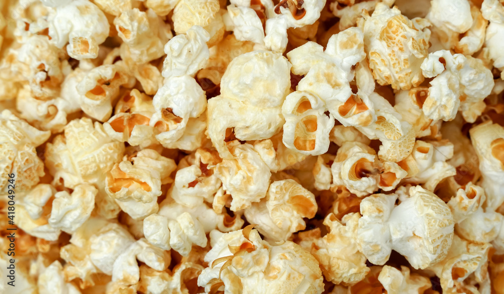 Popcorn spinning in circles around the center of frame. showing detail in the popcorn kernels. Popcorn spinning in circles around the center of frame. showing detail in the popcorn kernels.