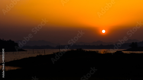 Sunset at Watchialalongkorn Dam , Pompi Nationality Park, Karnchanaburi, Thailand photo