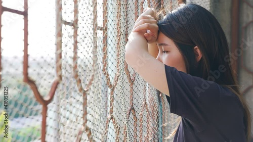 Portrait of Depressed Asian woman concept of Mental health, imprisonment Human trafficking and broken married