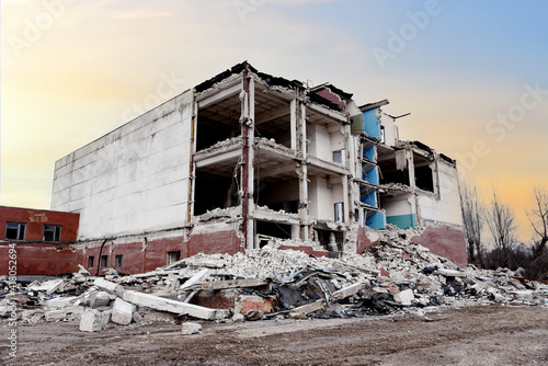 View of the demolition of a multi-storey building. Dismantling and demolition of buildings and structures. Destroy concrete