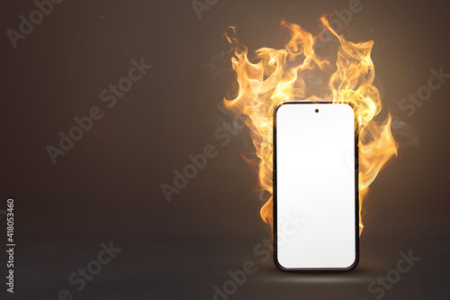 Blank smartphone on fire with copy space photo