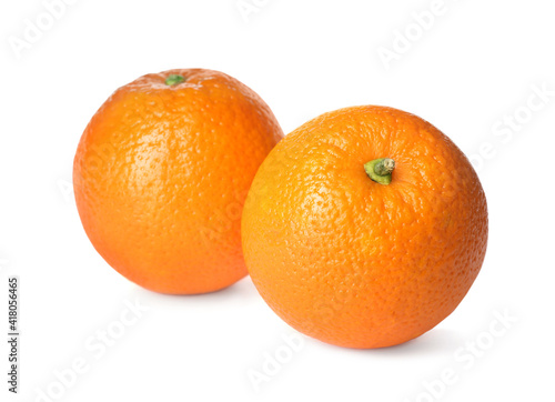 Delicious fresh ripe oranges on white background