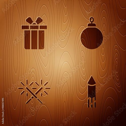 Set Firework rocket, Gift box, Sparkler firework and Christmas ball on wooden background. Vector.