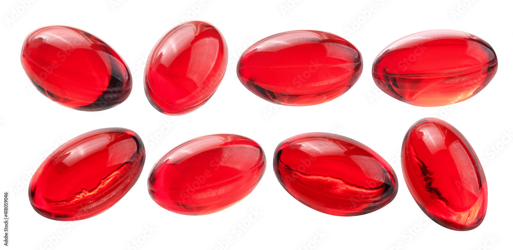 A set of red capsules. Isolated on a white background A set of red capsules. Isolated on a white background