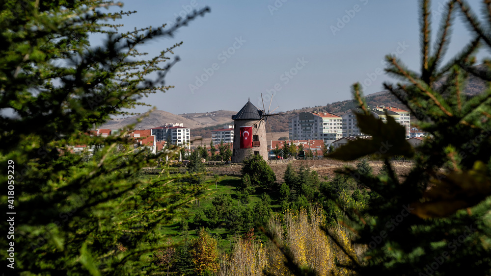 The windmill in the open air museum with the Turkish flag hanging on it  Wind mild in Altinkoy village, Ankara