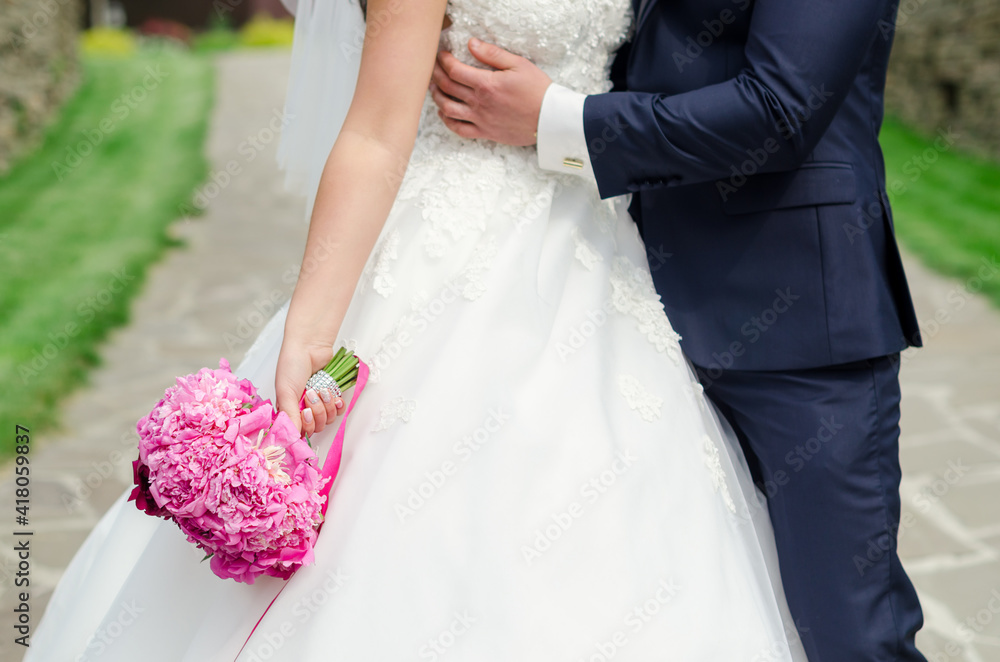 Bride and groom with a wedding bouquet. Background for the invitation.