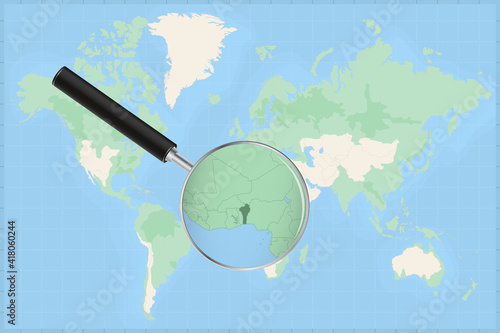Map of the world with a magnifying glass on a map of Benin.