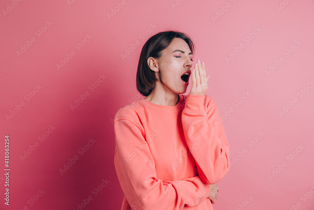 Woman wearing casual sweater on background bored yawning tired covering mouth with hand. Restless and sleepiness Woman wearing casual sweater on background bored yawning tired covering mouth with hand. Restless and sleepiness