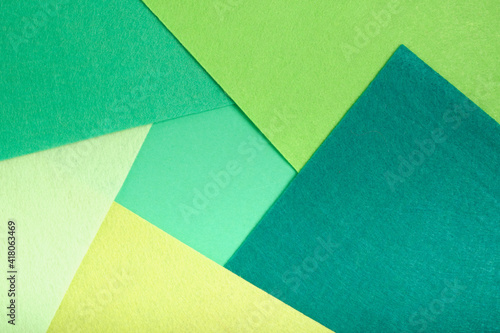 textured geometric background of felt several shades of green, mock up