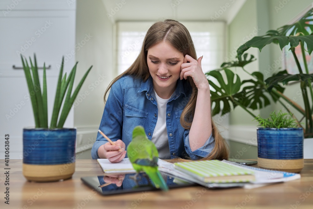Young female university student studying online using video communication Young female university student studying online using video communication