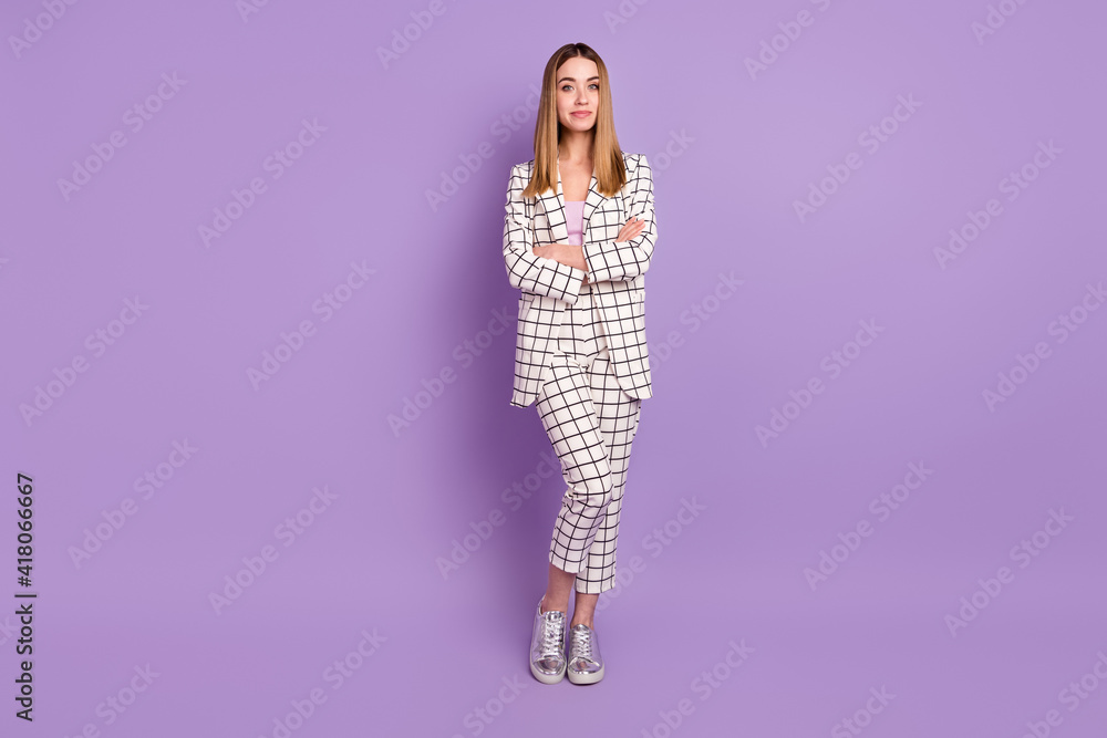 Full size photo of optimistic blond hair lady crossed arms wear suit isolated on violet color background Full size photo of optimistic blond hair lady crossed arms wear suit isolated on violet color background