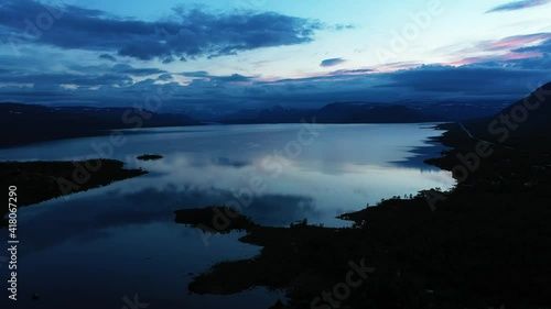 Aerial view towards lake Kilpisjarvi, gloomy, summer evening, in Arctic wilderness of Lapland photo