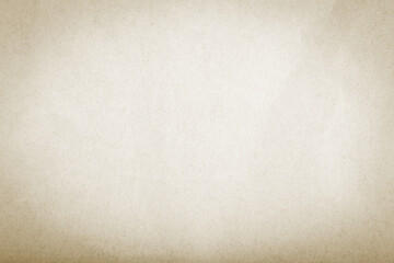 Rough-textured beige paper used as wallpaper or background with copy space