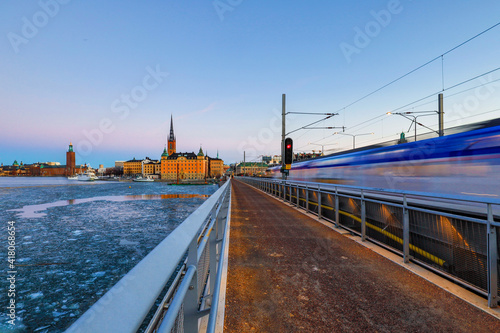 Stockholm, Sweden Riddarholmen island and a pedestrian and train bridge.