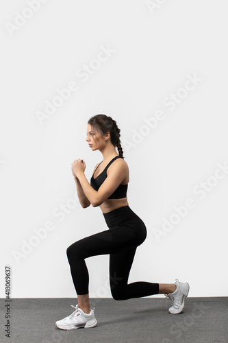 Fitness woman doing lunges exercises for leg muscle workout training