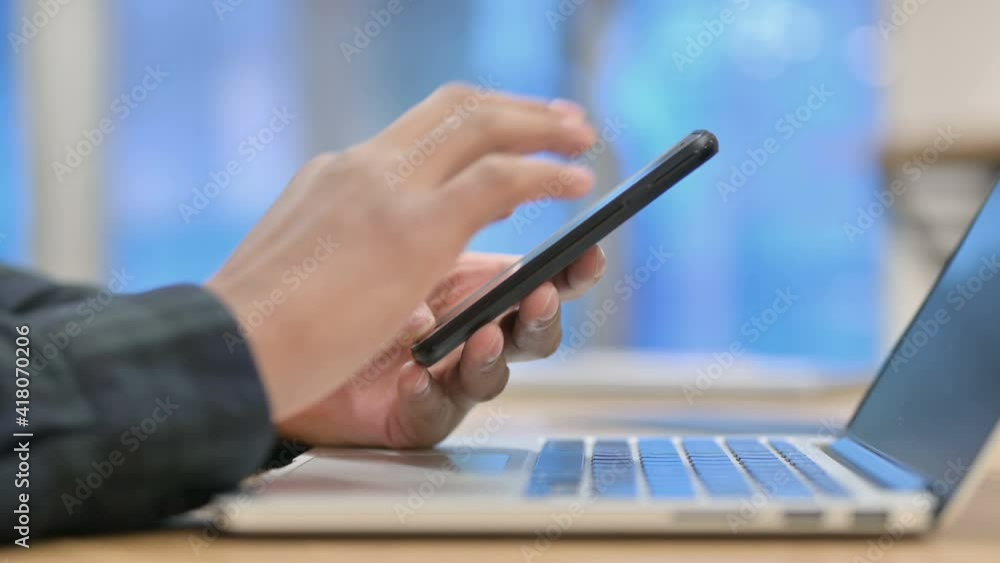 Close up of African American Man using Smartphone Close up of African American Man using Smartphone